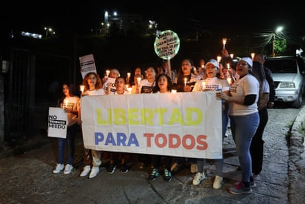 a group of women hold a sign