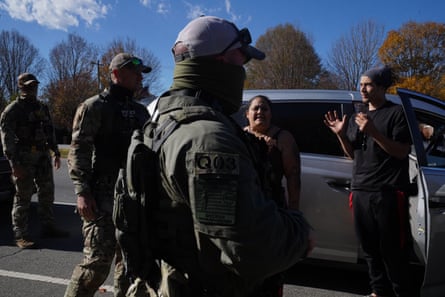 a group of people speaking to one another