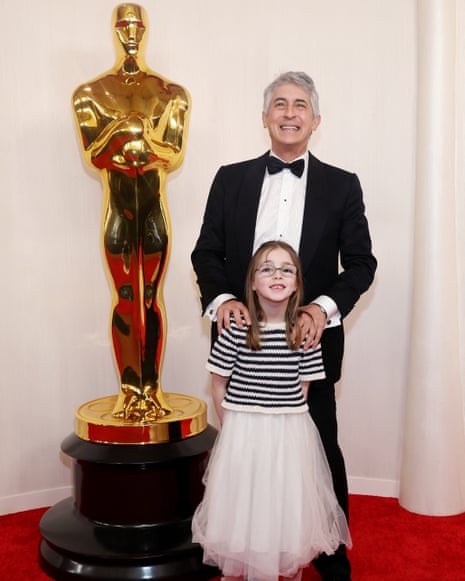 96th Academy Awards - Oscars Arrivals - HollywoodAlexander Payne and his daughter pose on the red carpet during the Oscars arrivals at the 96th Academy Awards in Hollywood, Los Angeles, California, U.S., March 10, 2024. REUTERS/Aude Guerrucci