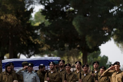 Israeli soldiers carry the coffin of the staff sergeant Elisha Yehonatan Lober, who was killed in battle in the Gaza Strip, during his funeral at the Mount Herzl military cemetery in Jerusalem, Israel.