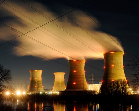 Big towers seen at night and white vapour emerging from them