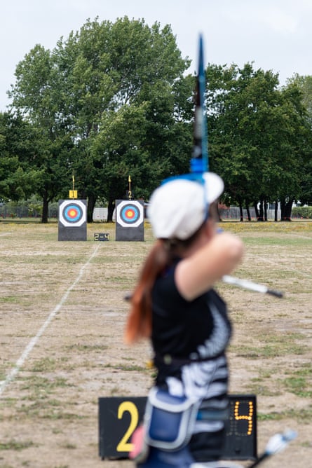 Young archer prepares to shoot an arrow