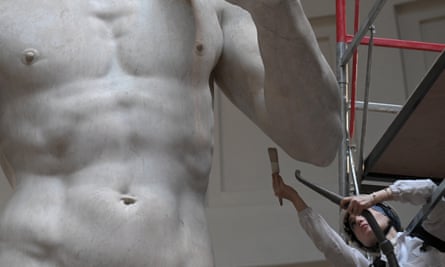Eleonora Pucci cleaning Michelangelo’s statue of David at the Accademia Gallery in Florence