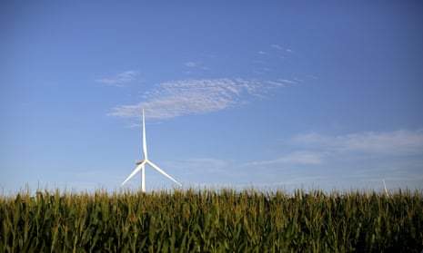 A wind turbine is seen in a field of corn in Haverhill, Iowa.
