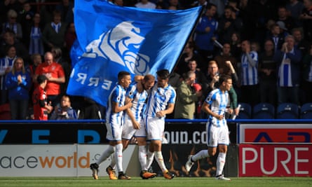 Huddersfields Laurent Depoitre, second left, celebrates with his team-mates after scoring his side’s first goal.