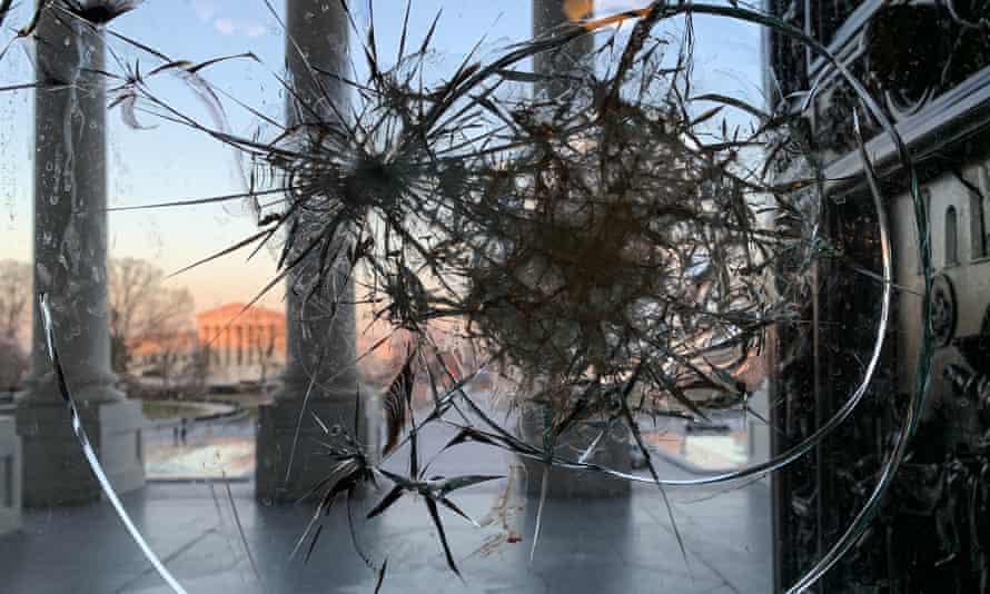 A window at the US Capitol building broken by supporters of US President Donald Trump.