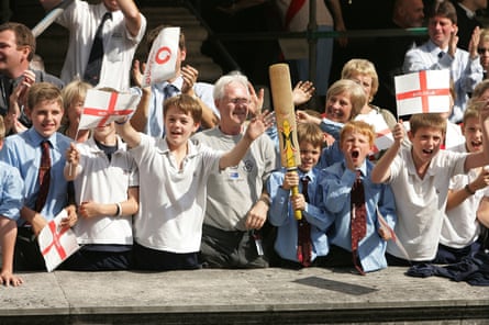 Children cheering the England team’s Ashes victory parade.