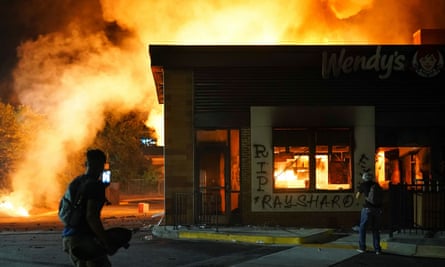 The Wendy’s restaurant where Rayshard Brooks was shot dead burns on Saturday.