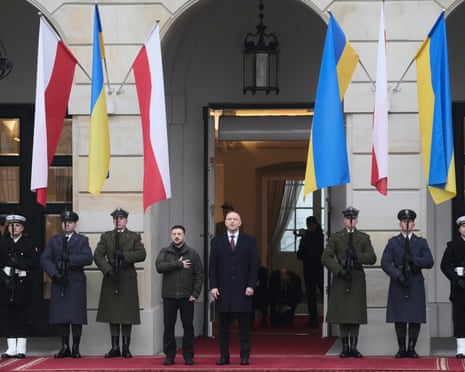Polish president Karol Nawrocki, center, and Ukrainian president Volodymyr Zelenskyy attend an official welcome ceremony before their meeting at the Presidential Palace in Warsaw, Poland.