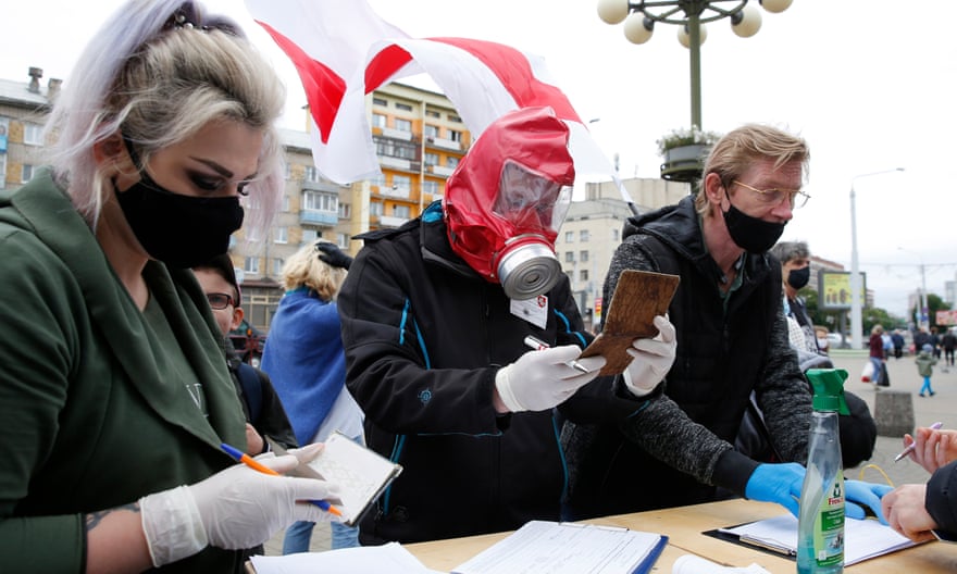 Activists wearing protective masks and gloves gather signatures in support of election candidates in Minsk