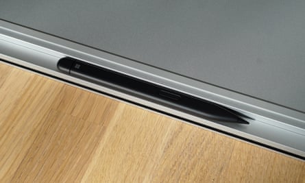 Slim Pen 2 clipped into place under the front of the Microsoft Surface Laptop Studio