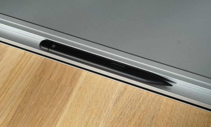 Slim Pen 2 clipped into place under the front of the Microsoft Surface Laptop Studio