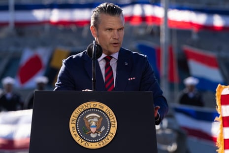 Pete Hegseth speaks at a presidential lectern outdoors during an event