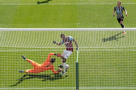 West Ham’s Issa Diop centre tanges with goalkeeper Lukasz Fabianski as he scores an own goal.