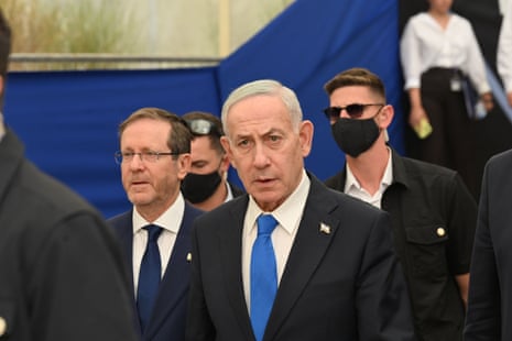 Netanyahu walking with security.