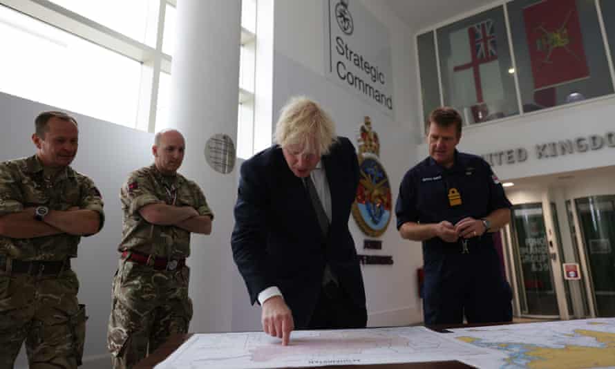 Boris Johnson with V Adm Ben Key as he looks at a map of Afghanistan during a visit to Northwood headquarters