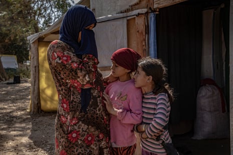 Mariam, 49, with her daughters