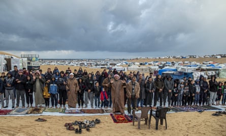 Palestinians hold Eid prayers in front of tents set up near the Egyptian border.