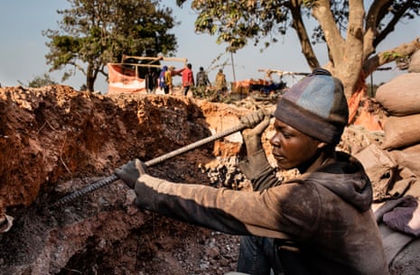 A young miner digs for cobalt in the Democratic Republic of Congo