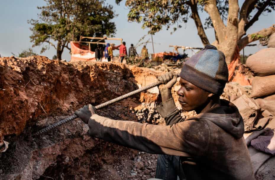 A young miner digs for cobalt in the Democratic Republic of Congo