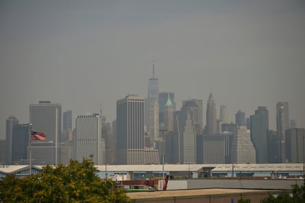 a hazy sky and a group of tall buildings