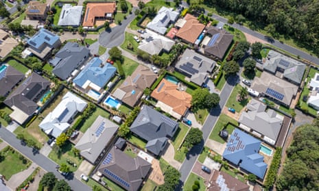 Homes in Queensland with solar panels on roofs.