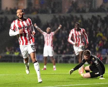 Lewis Baker (left) wheels away after making it 3-0 to Stoke against Oxford