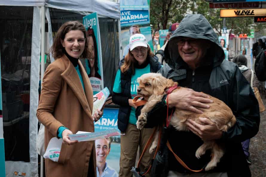 Allegra Spender speaks to voters outside the Oxford Street Mall prepolling booth on Friday, a day before the federal election.