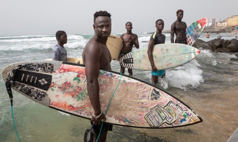 Babacar Thiaw and other surfers on Dakar Beach