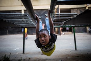 A boy enjoys his afternoon on one of the three public trampolines in the township of Alexandra in Johannesburg