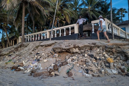 Erosion has exposed tree roots and the crumbling coastline is affecting the terrace of the Leybato hotel in Fajara.