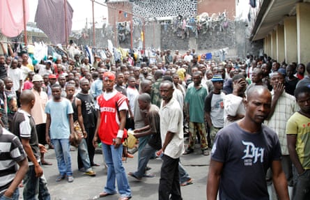 African prisoners gather in a crowded prison courtyard