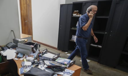 Carlos Fernando Chamorro walks through his ransacked offices