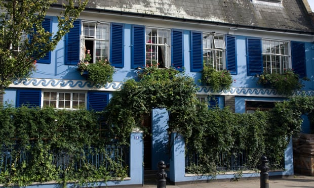 Closing shutters on older homes – such as this blue-painted house on Portobello Road, west London – is an effective way to keep out the sun.