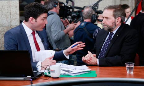 CBC personality Evan Solomon interviews NDP leader Thomas Mulcair on budget day on Parliament Hill in Ottawa in 2013.