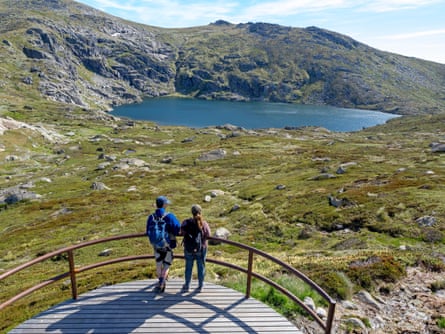 Hikers at Blue Lake in Kosciuszko national park.