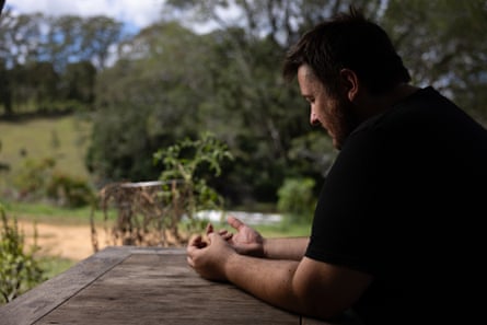 Jake sitting at a table outdoors