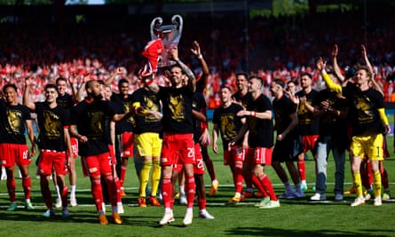 Union Berlin players celebrate in May after qualifying for the Champions League