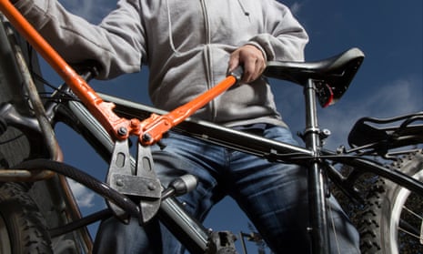 Bike lock being cut with bolt cutters