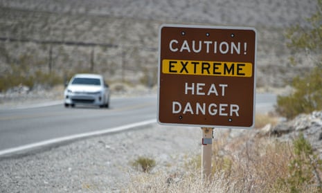 A posted sign warns motorists of extreme heat dangers in Death Valley National Park, in Furnace Creek, California.