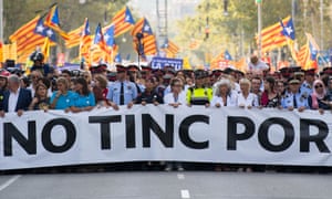 Police and emergency service workers carrying a banner reading no tinc por (I am not afraid) on a march through Barcelona.