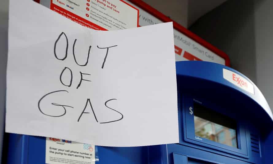 A sign at an exxon station saying out of gas after a cyber-attack crippled the biggest fuel pipeline in the country, run by colonial pipeline.