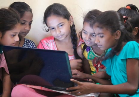Girls learn how to use computers at a Dharavi Diary slum school in Mahim, Mumbai.