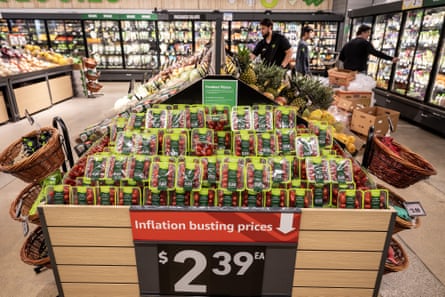 A sign advertises ‘inflation busting prices’ at an Amazon Fresh grocery store in Schaumburg, Illinois, in July.