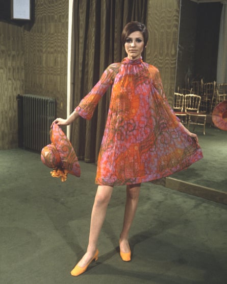 Focus on fashion: a model wears Pierre Cardin in the Observer Magazine, 1967. The original caption: “Rising-sun hues printed and pleated for hot afternoons, blossom-trimmed hat, flared skirt and sleeves.”