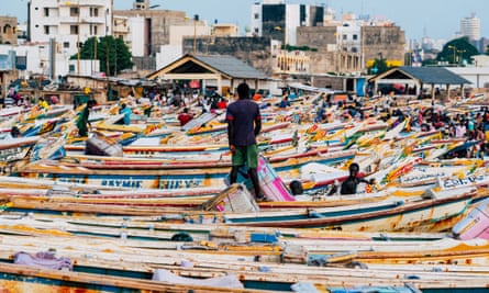 Boats crowd the waterfront at Soumbedioune market.