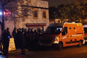 Officers stand guard along a security area near a retirement home for Catholic missionaries in Montferrier-sur-Lez.