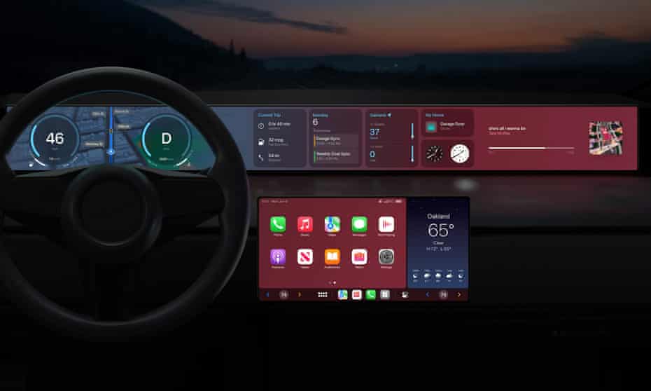 Apple's CarPlay in action in a mock-up of a new vehicle: a large dashboard is accompanied with second large screen below.