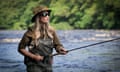 Marina Gibson standing in a river, flyfishing