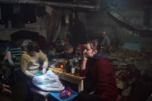 Anna sits with her daughter Nastya in a basement as Russian attacks continue nearby in Soledar